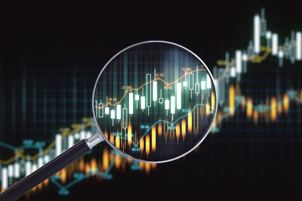 Magnifying glass with candlestick chart on virtual screen. Forecast and trade concept. Close up. 3D Rendering